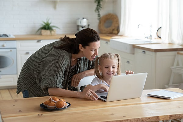 mother and child looking at laptop