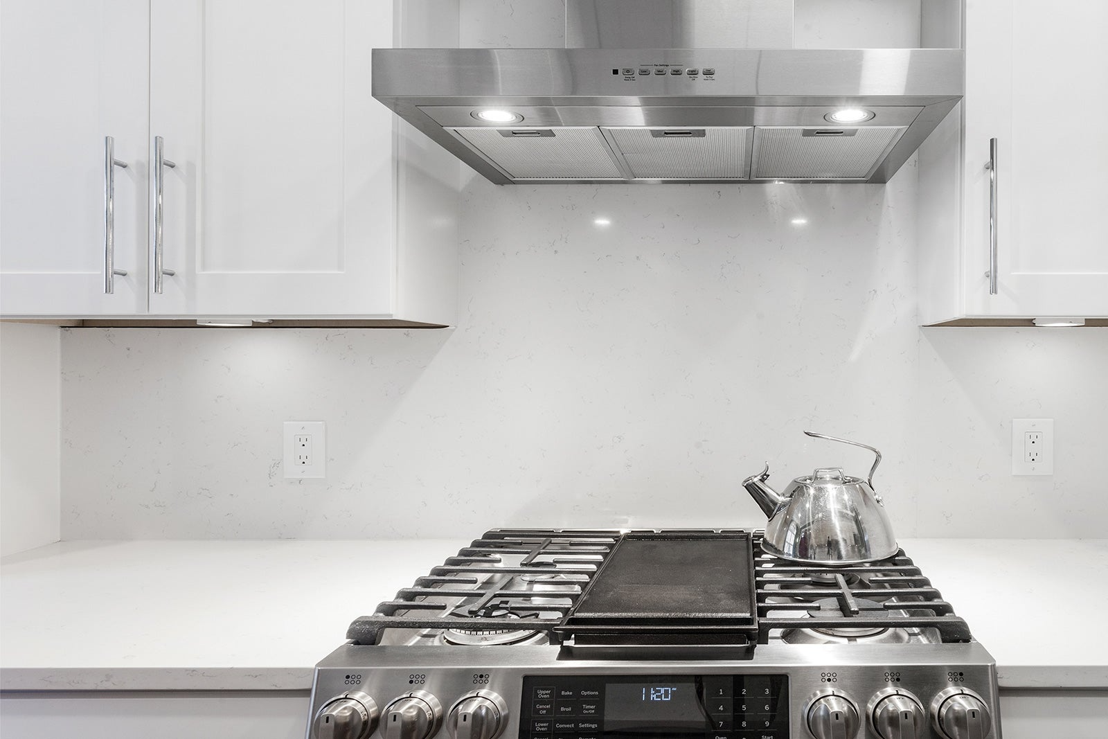 Chrome stovetop and range hood cover