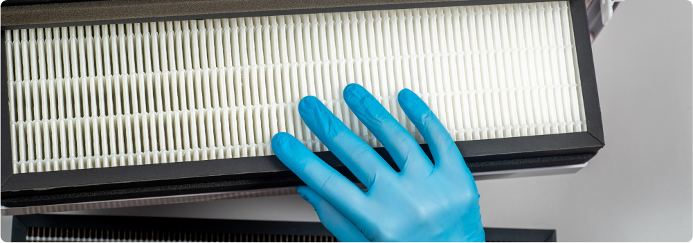 Homeowner replacing HVAC filter