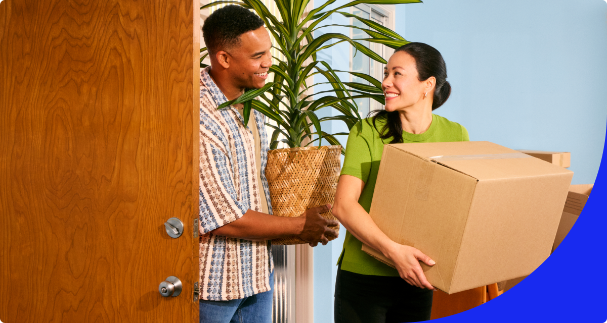 Couple moving in with boxes 