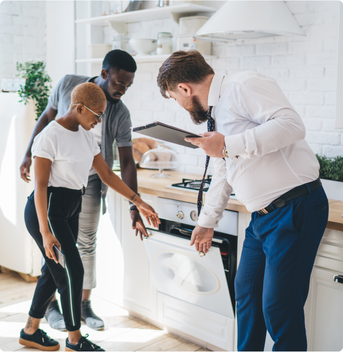 Group of people checking oven