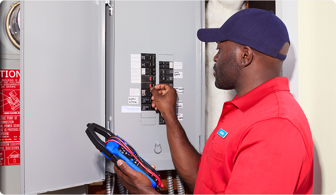 Expert inspecting the breaker box.