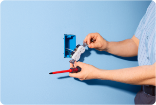 Person taking out electrical socket