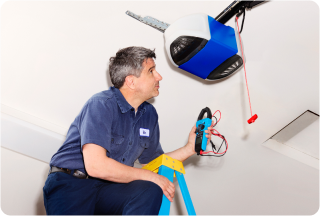 Person fixing garage door opener