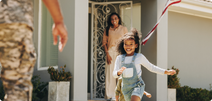 child running to man in uniform