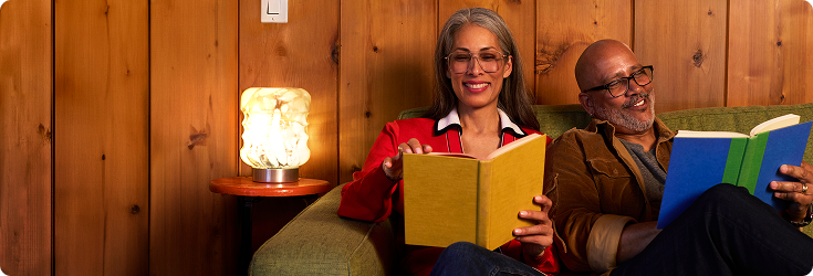 Couple reading together on a couch