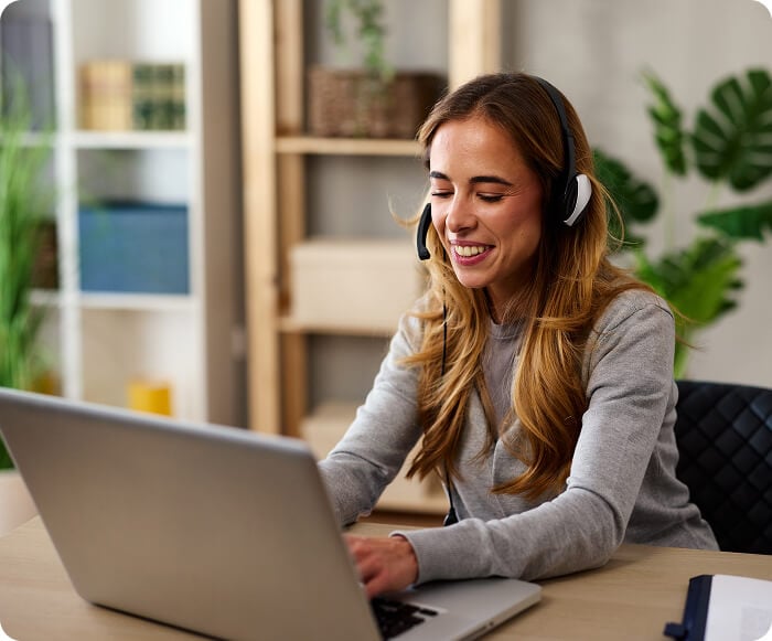 Customer service rep smiling and talking to a customer