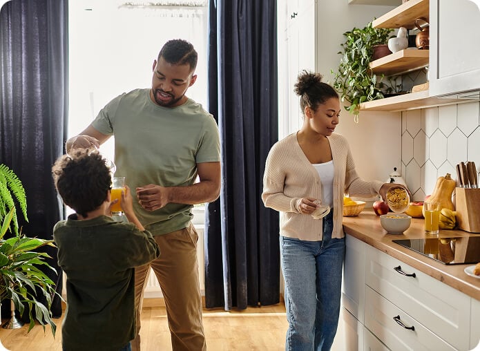 Happy family preparing food together in the kitchen