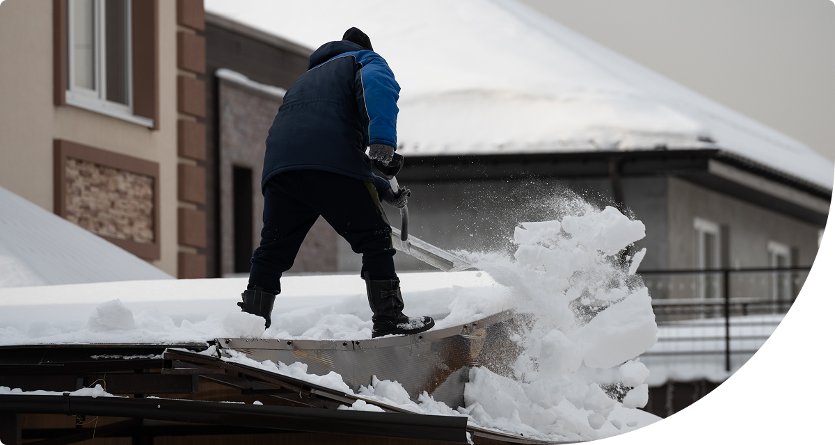 Shoveling snow from roof
