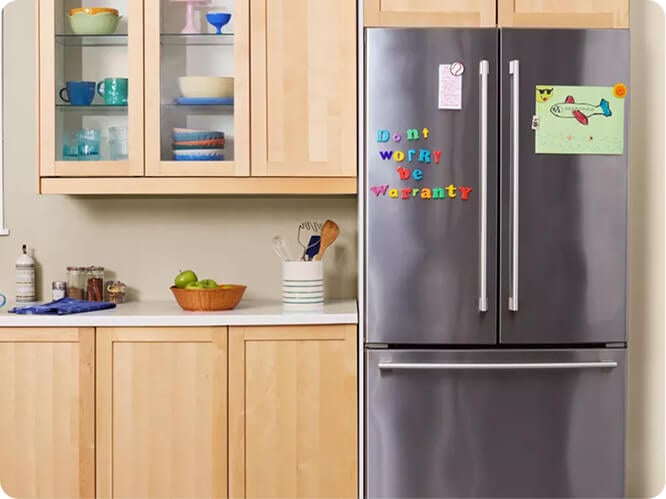 Refrigerator with the words 'Don't worry be warranty' on the front door